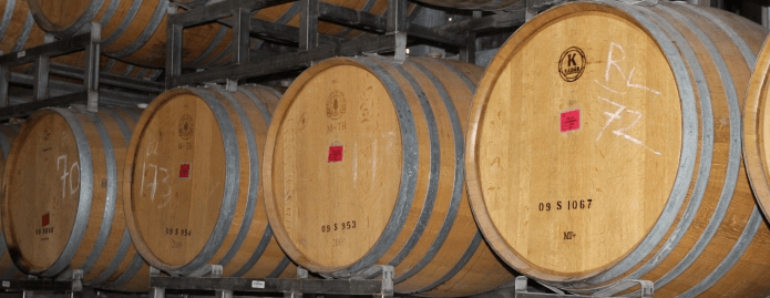 A row of wooden wine barrels.